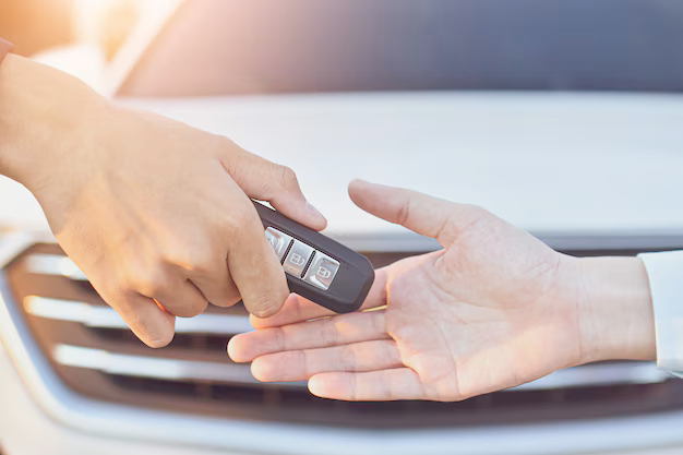 Stylized key visual of a floating car and insurance keys